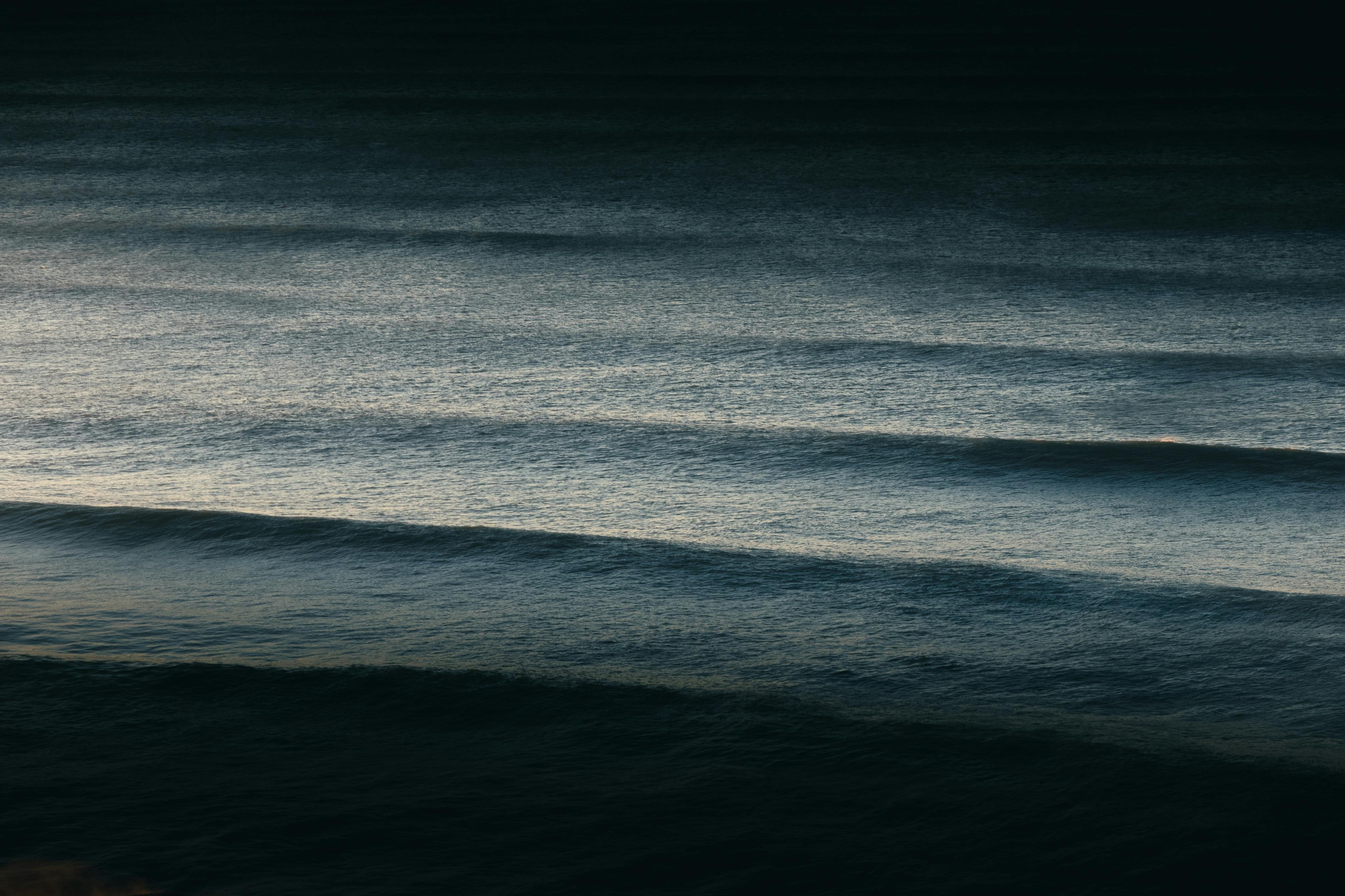 Serene ocean waves at dusk captured in Biarritz, France. Perfect for peaceful and atmospheric themes.