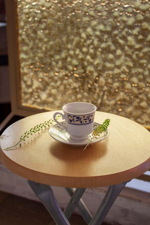 A Cup and Saucer on a Side Table