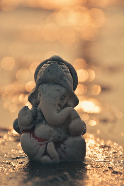 Free Ganesha Idol Figurine on the Ground Stock Photo