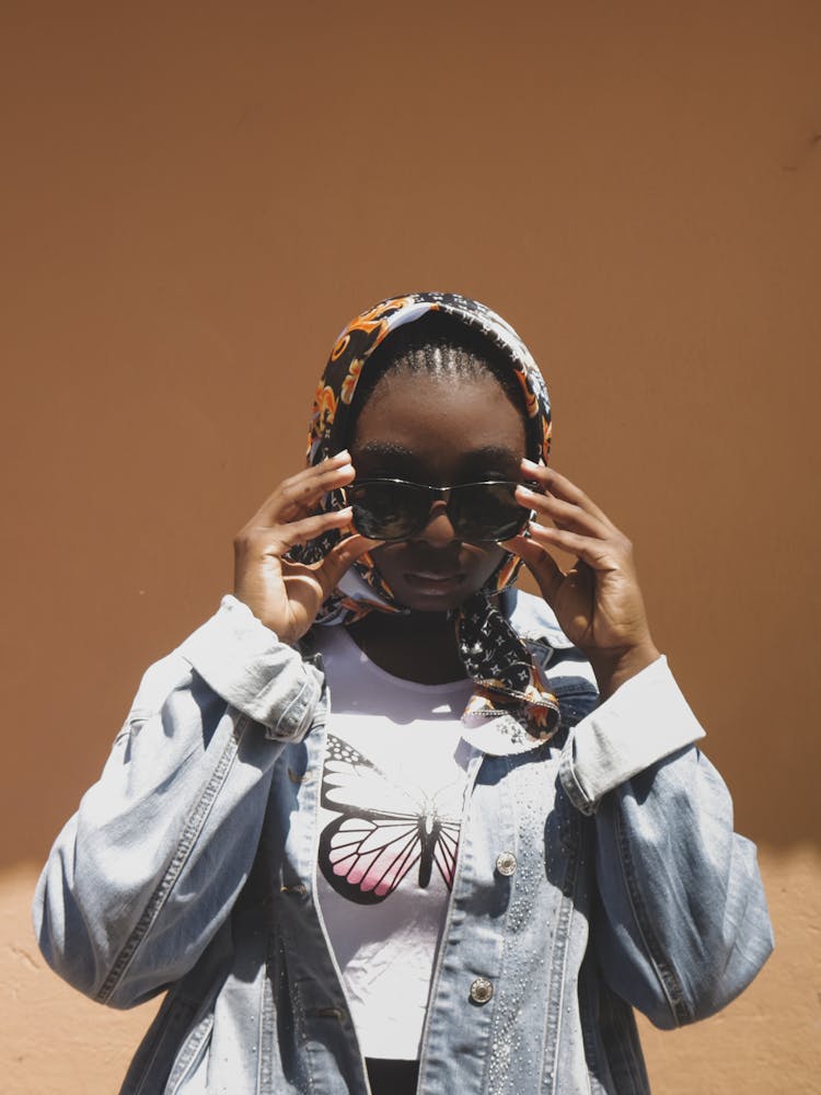 Woman Wearing A Scarf And Sunglasses