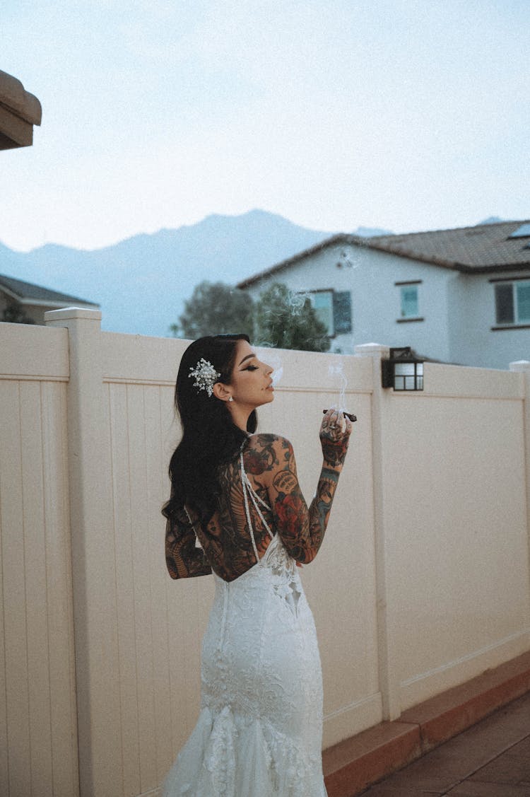 Tattooed Woman Smoking A Cigar