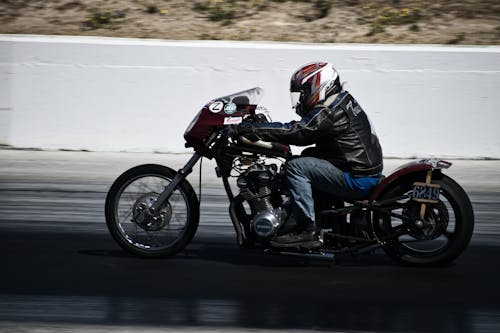 Free Man Riding Motorcycle Stock Photo
