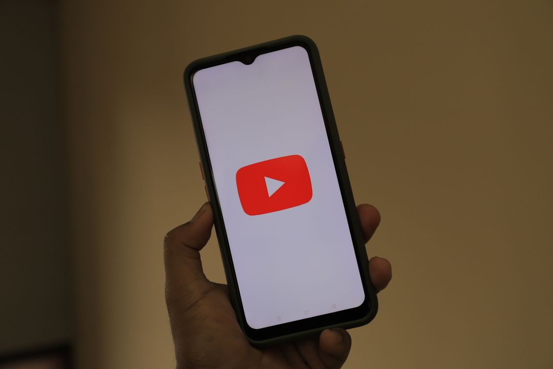 youtube ads - Saudi business owner reviewing YouTube Ads dashboard with CPV and conversion charts