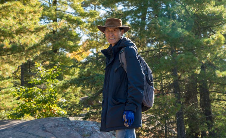 A Man Hiking A Mountain