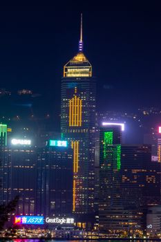 Stunning night view of Hong Kong's illuminated skyline featuring a prominent skyscraper.