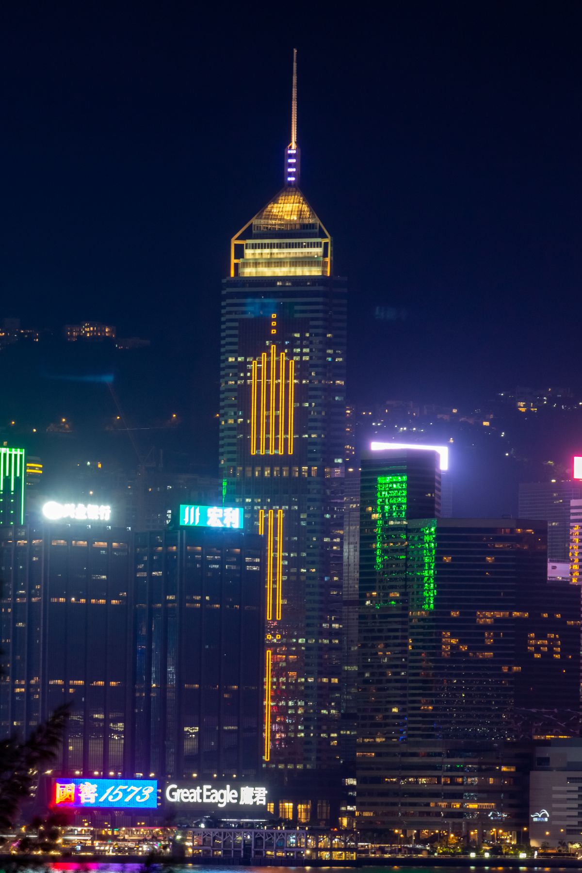 Hong Kong skyline during the night with city lights reflecting across the water