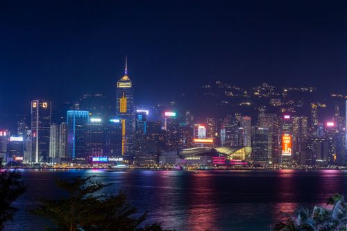 Free Spectacular night view of Hong Kong's skyline across Victoria Harbour. Stock Photo