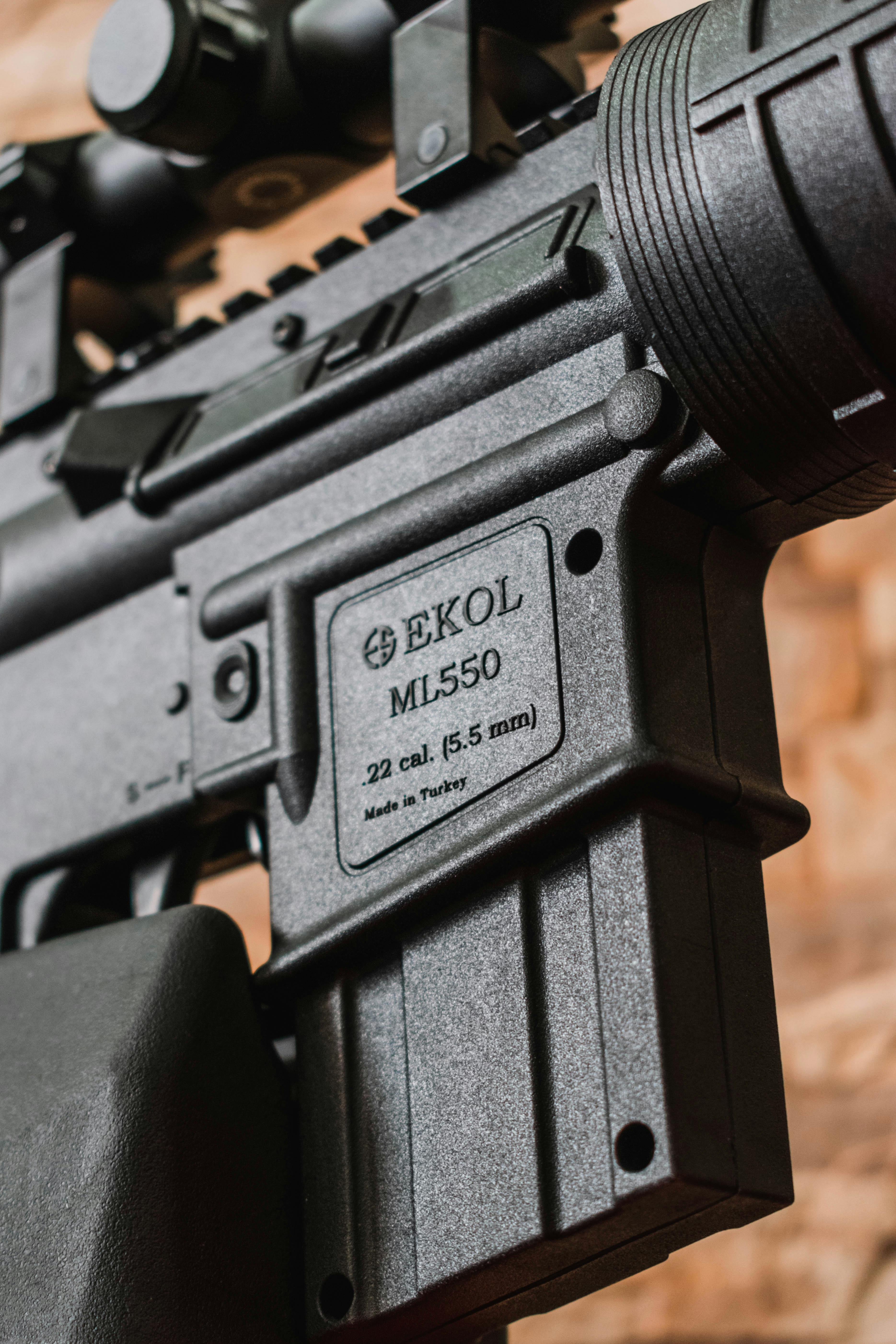 Detailed close-up of an EKOL ML550 air rifle showing cartridge and markings.