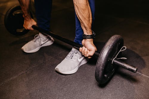 Free Person Lifting a Barbell Stock Photo