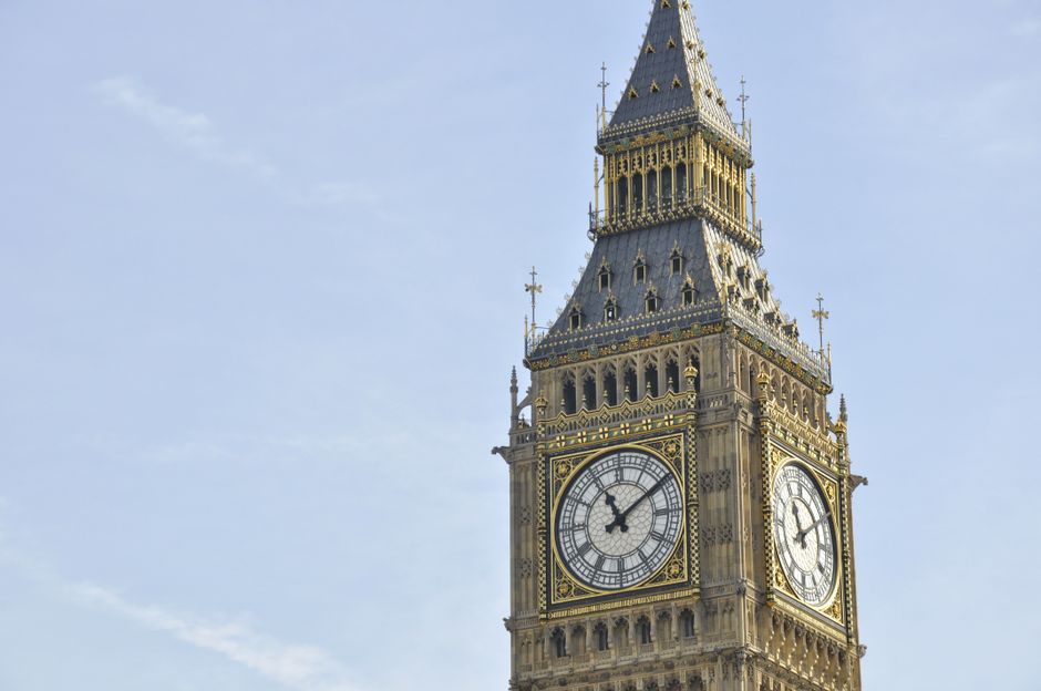 High angle view of Big Ben's clock tower in London with a clear blue sky background.