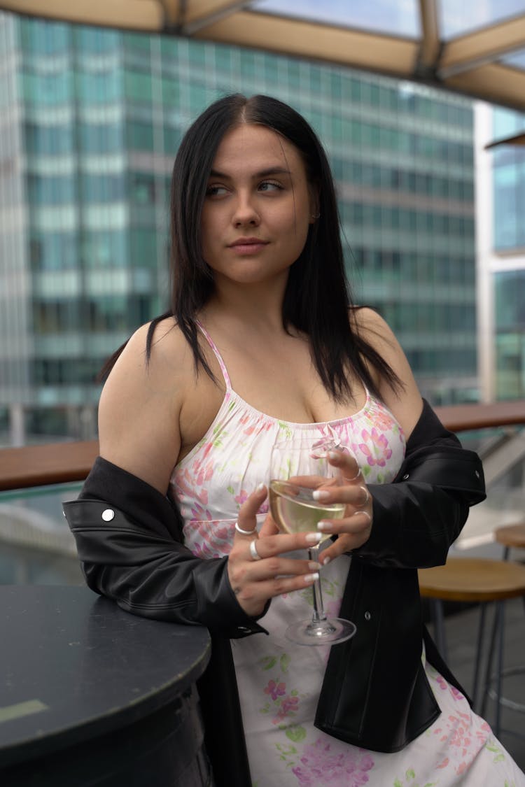 Photo Of Woman Wearing Floral Dress Holding A Drink