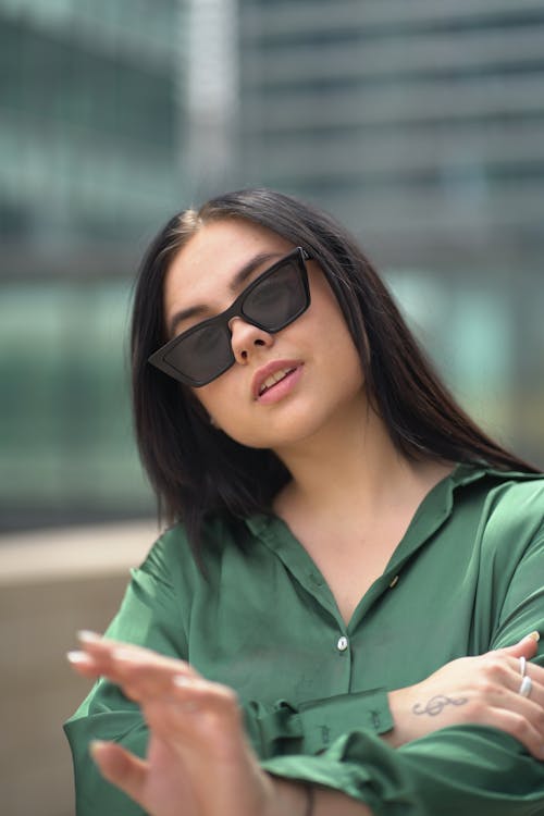 Close Up Photo of Woman Wearing Sunglasses
