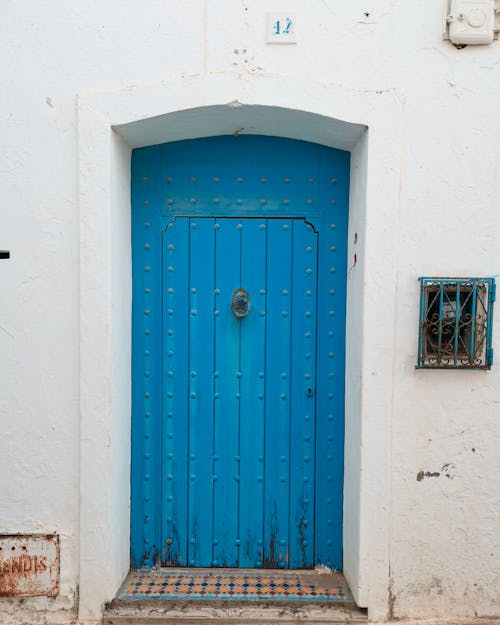 Blue Wooden Doors to Old House