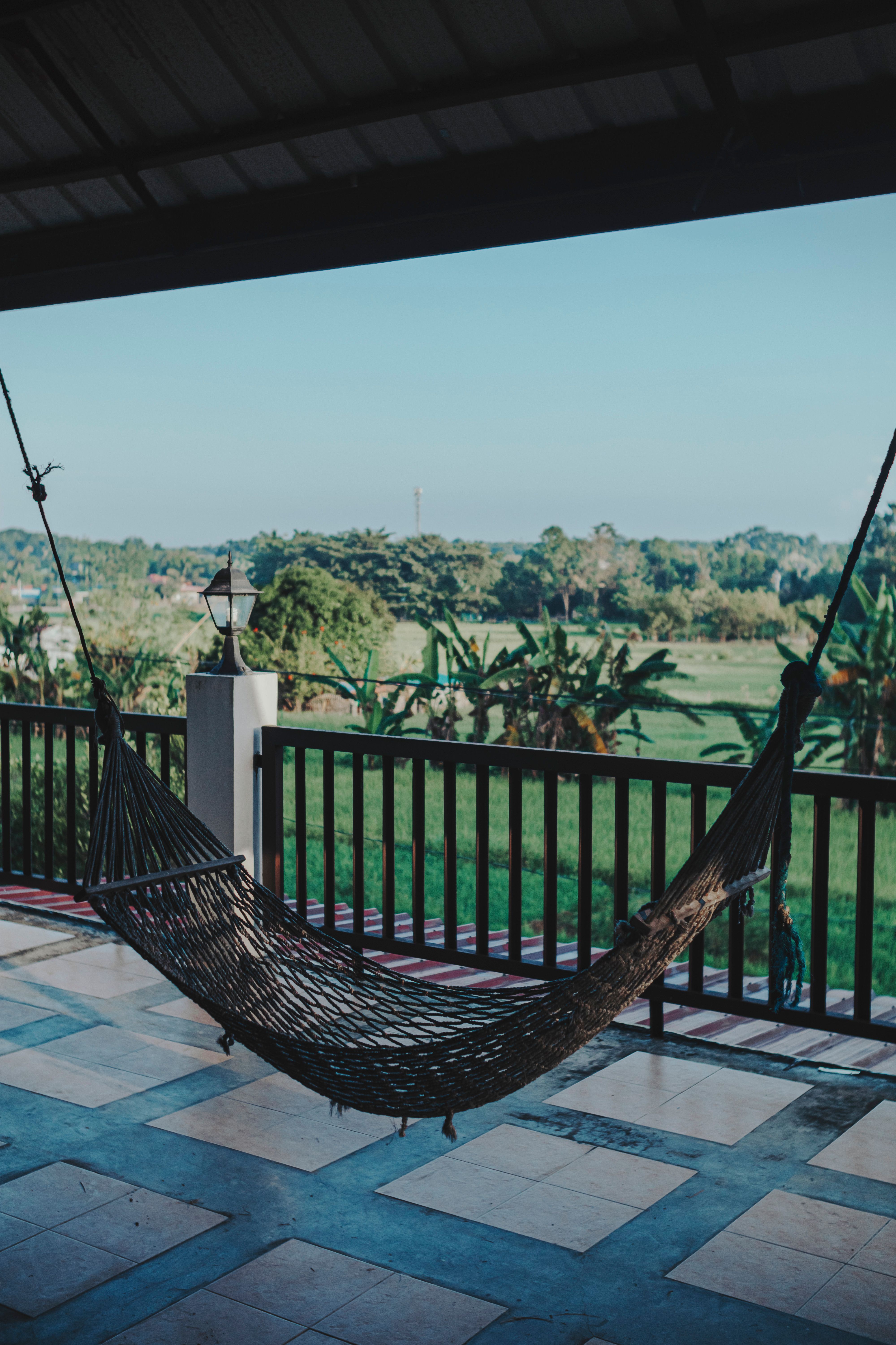 Hammock hanging on a balcony with a view, perfect for relaxing