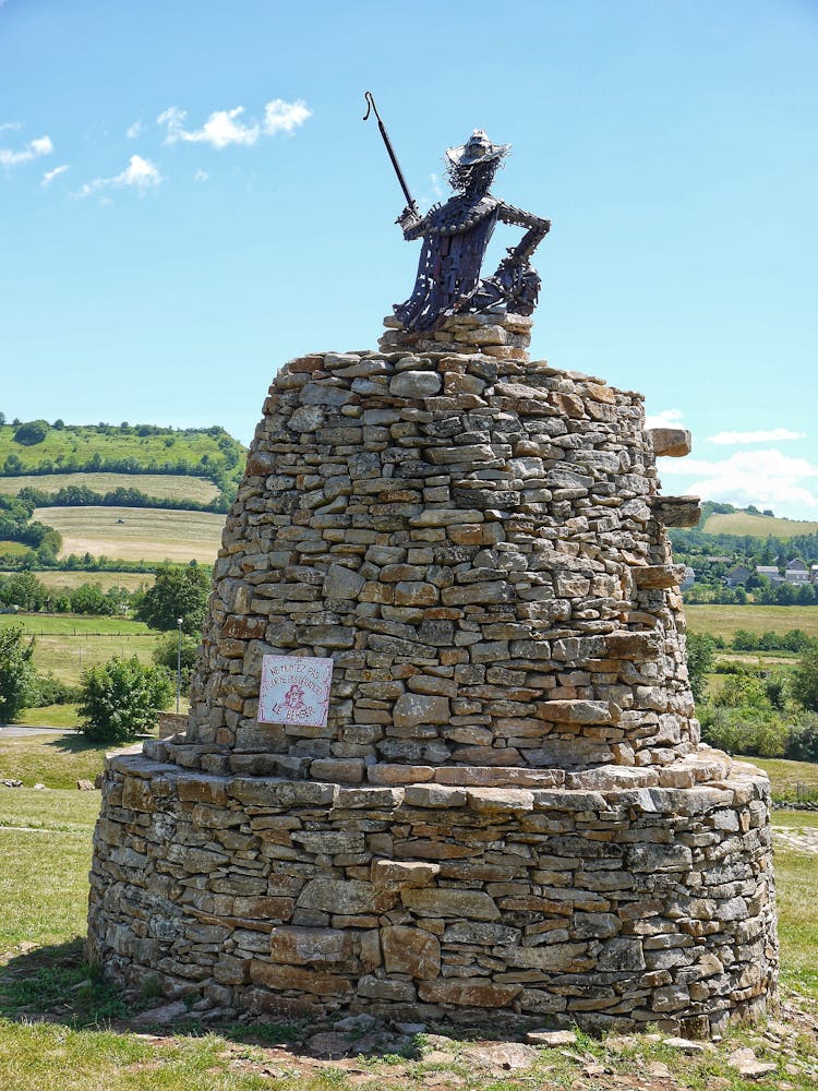 Metal Statue On Top Of Stone Structure