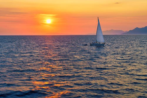 altın saat, deniz, deniz aracı içeren Ücretsiz stok fotoğraf