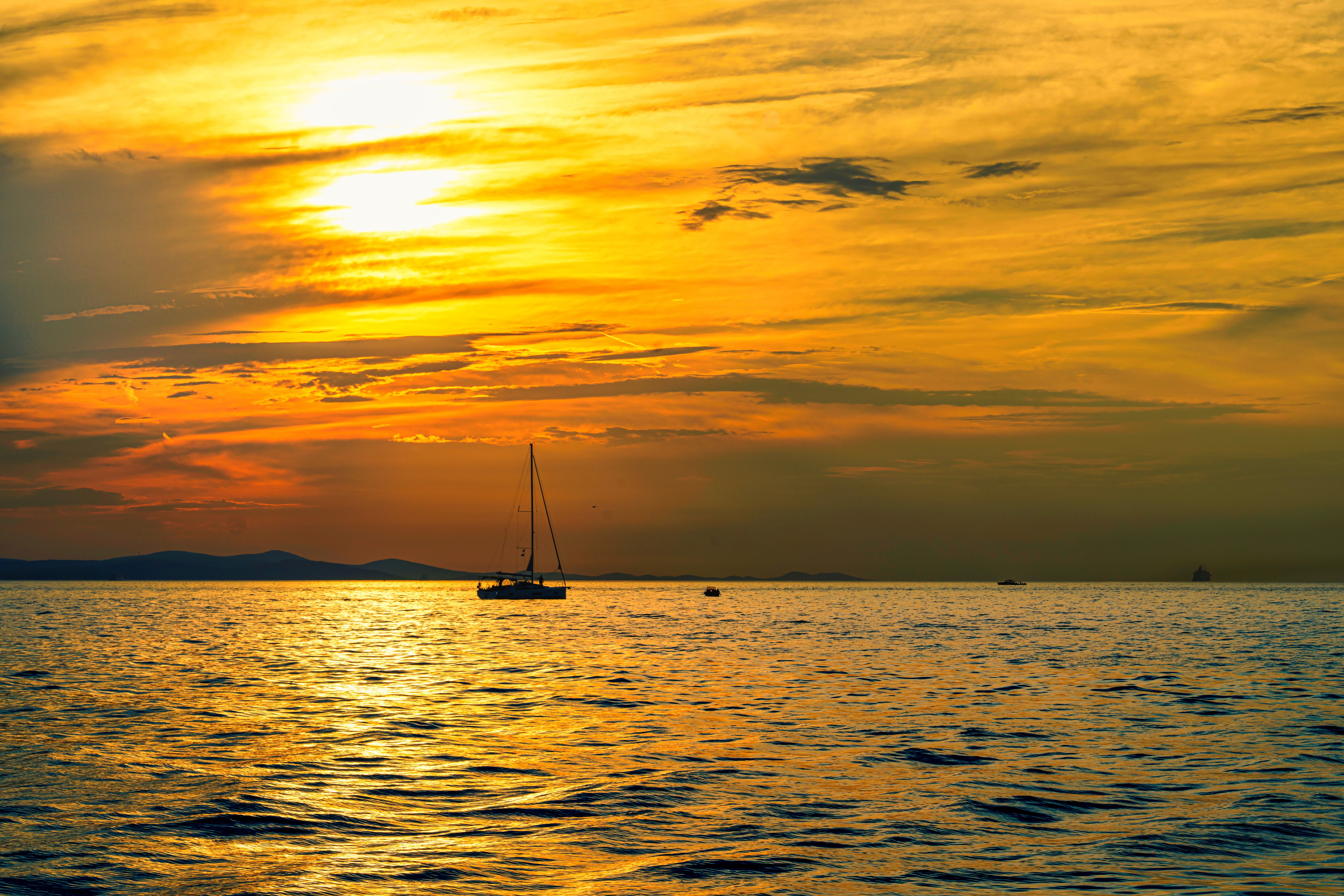 Silhouette of Boat on Sea during Sunset · Free Stock Photo