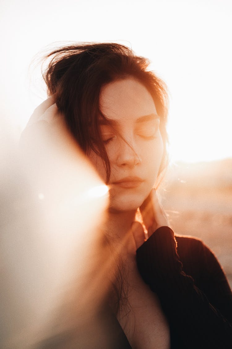 Portrait Of A Pretty Brunette Illuminated By The Sunlight