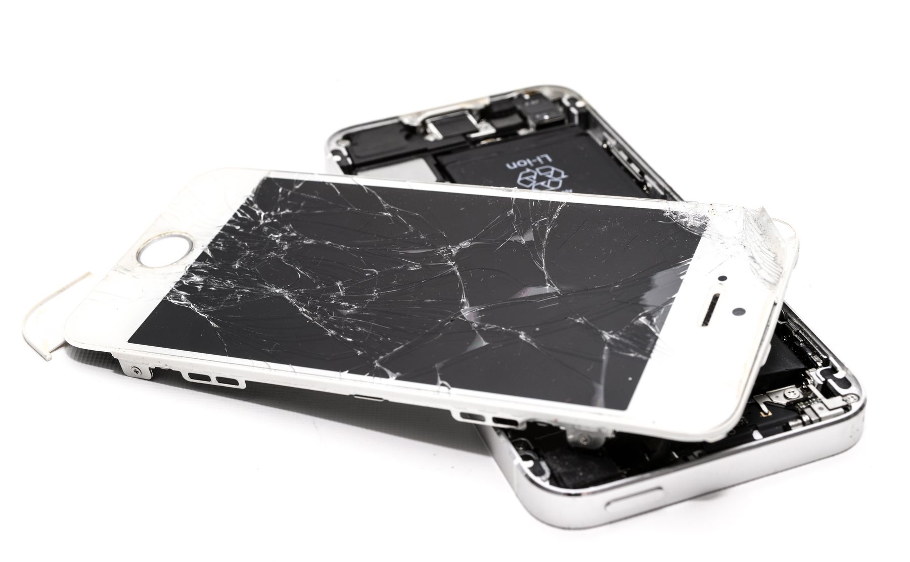 Broken smartphone with cracked glass during repair