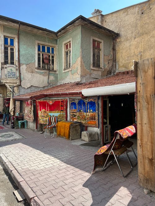 Free Colorful carpets hanging in a traditional street market setting, showcasing cultural heritage. Stock Photo