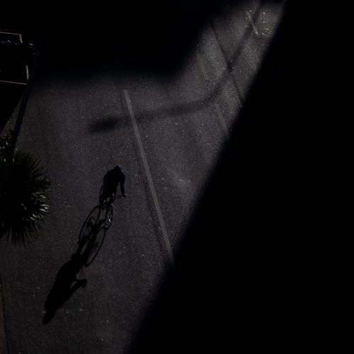 A Person on a Bicycle at Night 