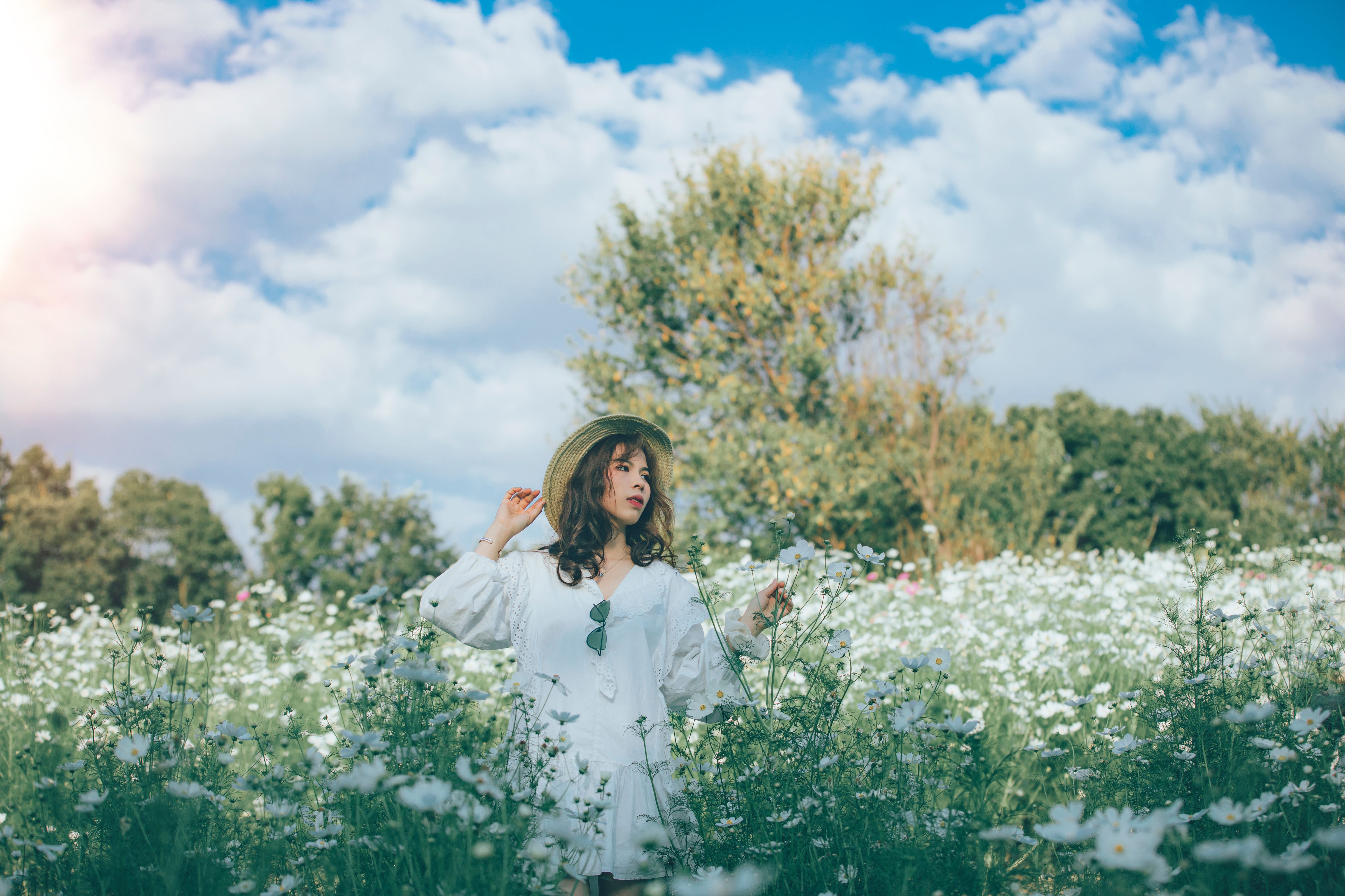 Woman Standing in Field of White Flowers · Free Stock Photo