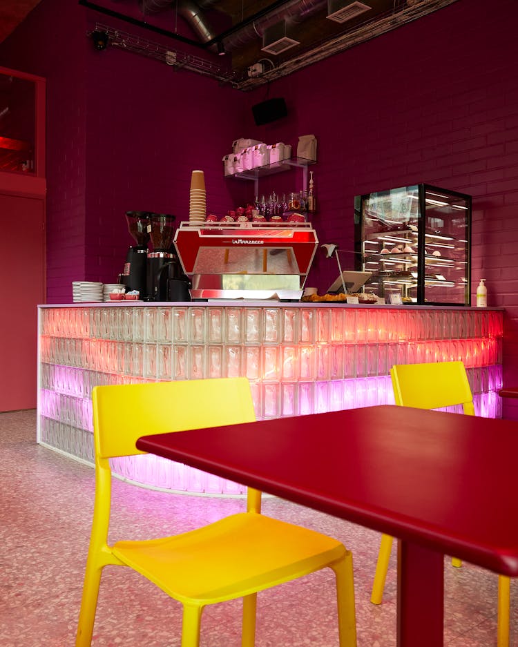 Yellow Chairs By Table In Empty Bar