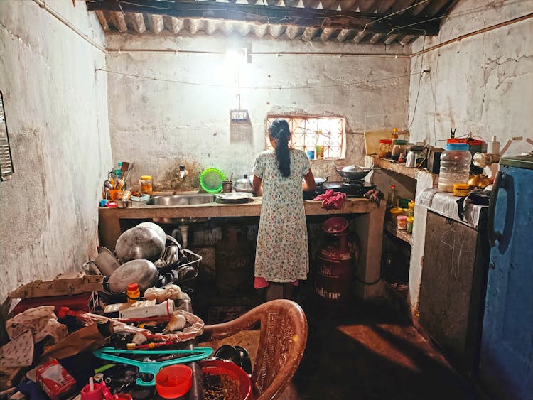 Woman In Floral Dress Inside A House 