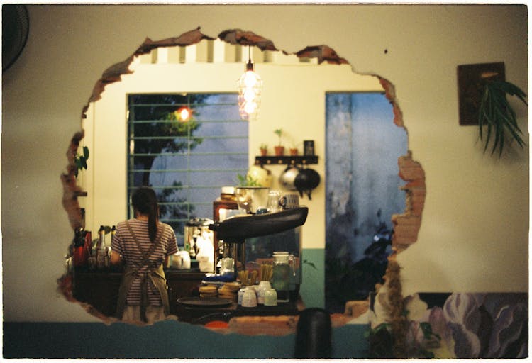 Hole In Wall Leading Into Cafe