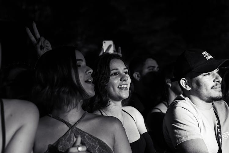 Grayscale Photo Of People At A Concert