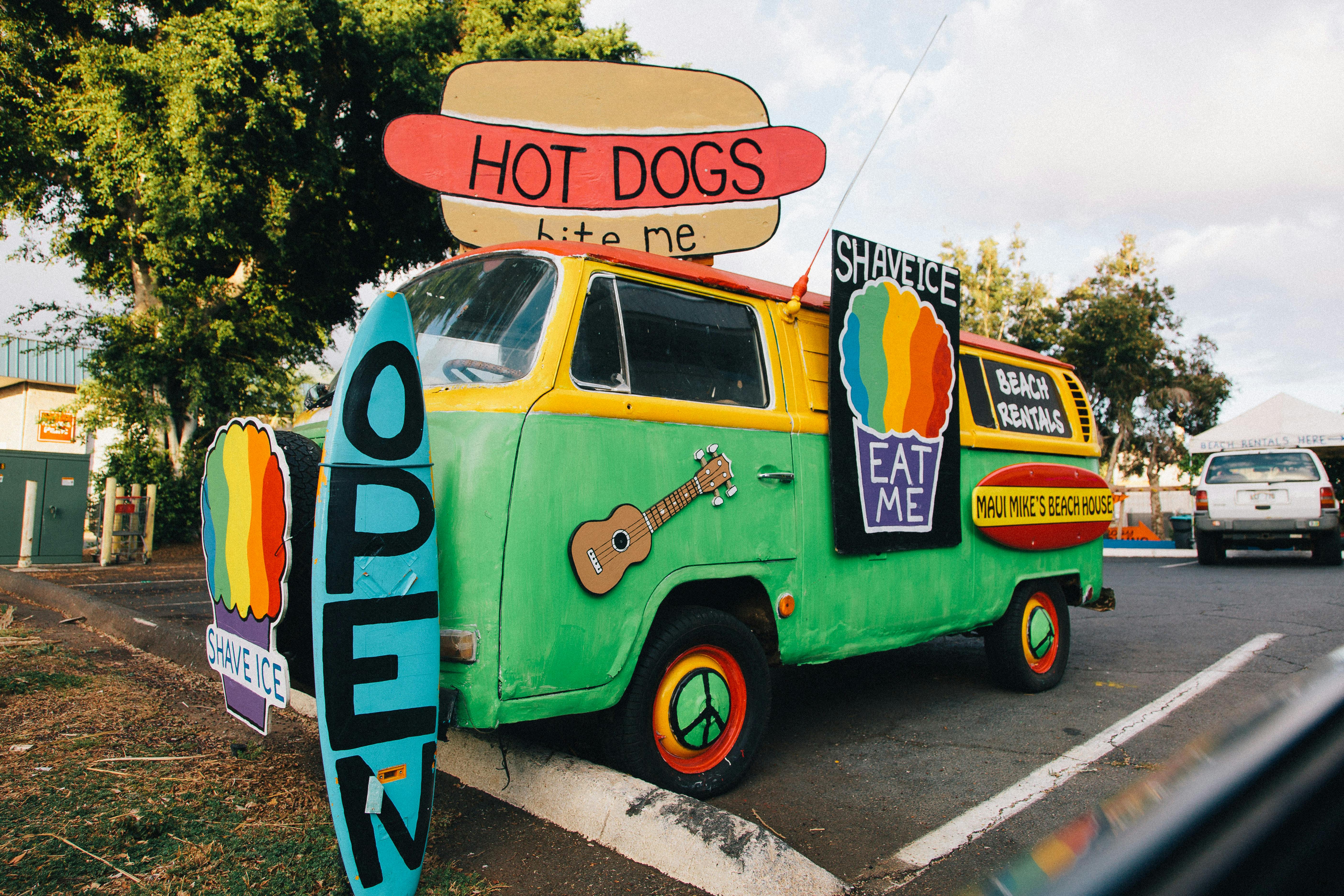 Colorful vintage food truck offering shave ice and hot dogs in Kaanapali, Hawaii.