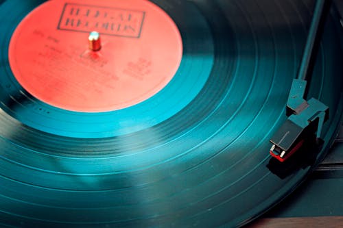 Free Blue Vinyl Record Playing on Turntable Stock Photo