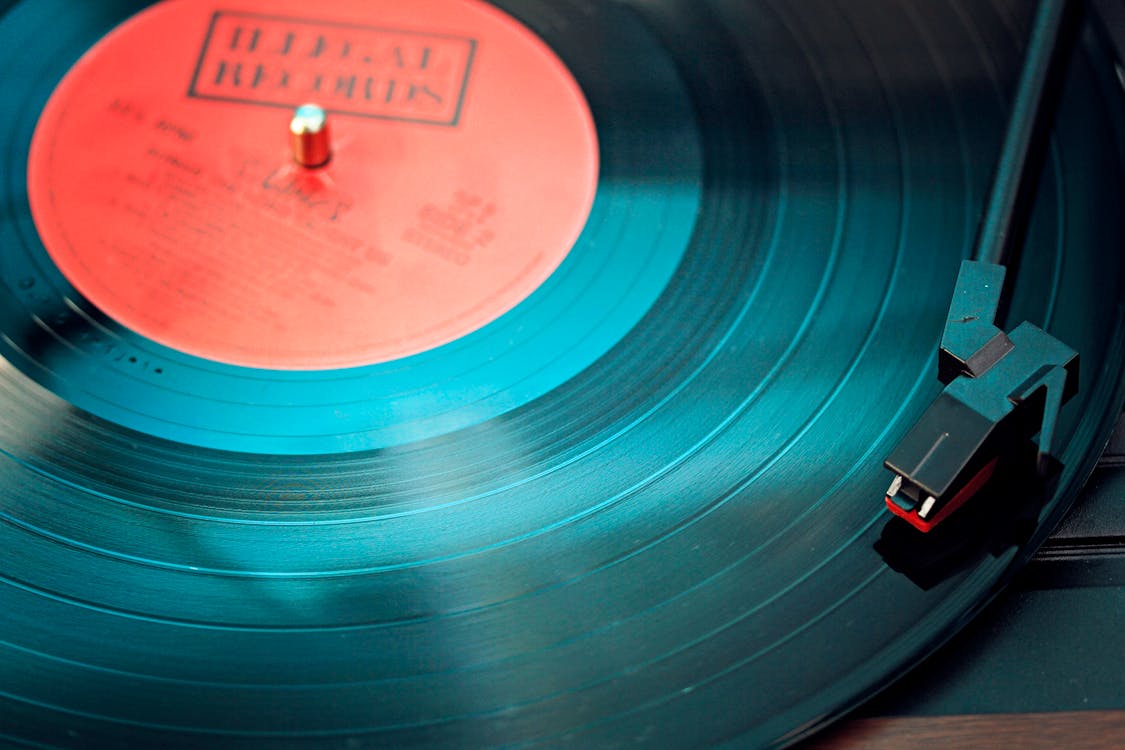Black Vinyl Record Playing on Turntable