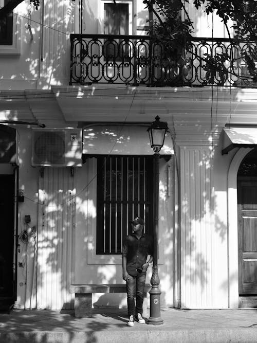 A Man Standing Near the Streetlight