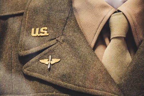 Free Gold-colored Us Brooch on Apparel Stock Photo