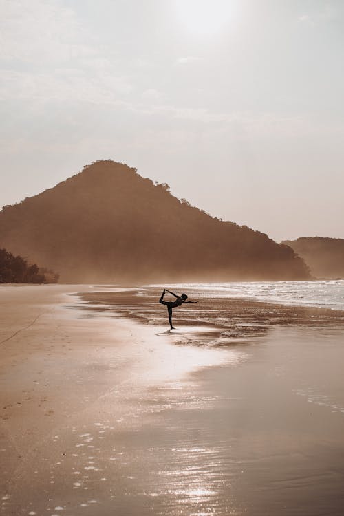  Woman in Yoga Pose on Beach