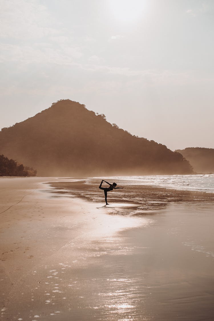  Woman In Yoga Pose On Beach