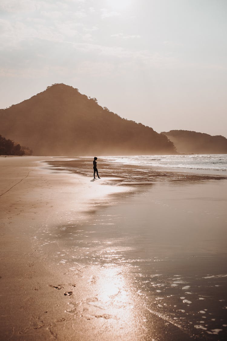  Woman In Yoga Pose On Beach