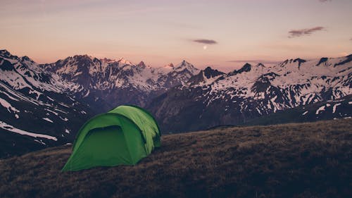 Green Tent on Top of a Mountain