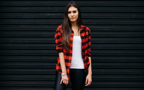 Photo of Woman Wearing Red and Black Checkered Shirt