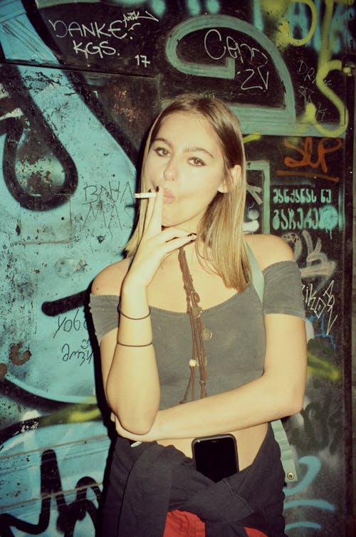 Portrait of a Pretty Blonde Smoking a Cigarette