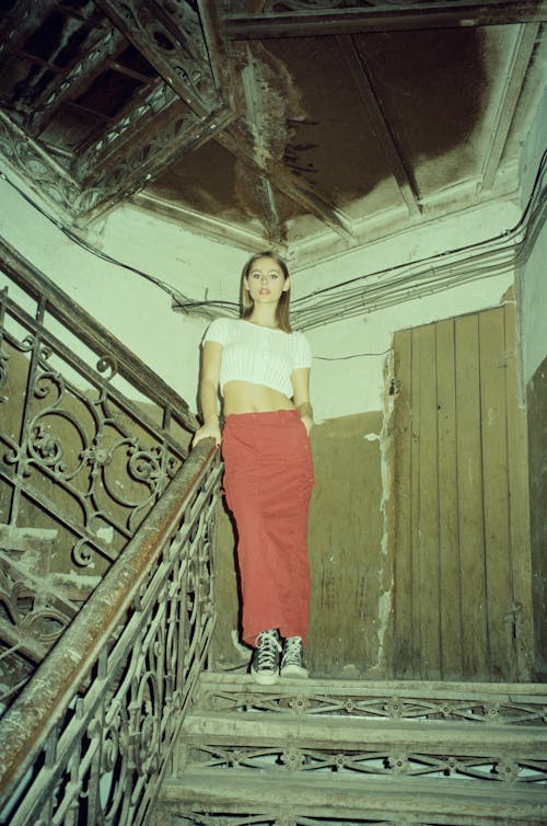 Pretty Blonde Posing on a Staircase