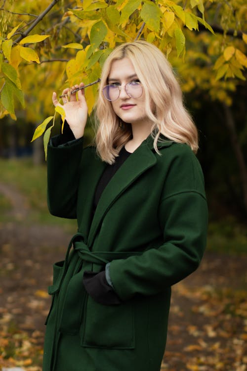 Photo of a Woman Wearing a Green Coat