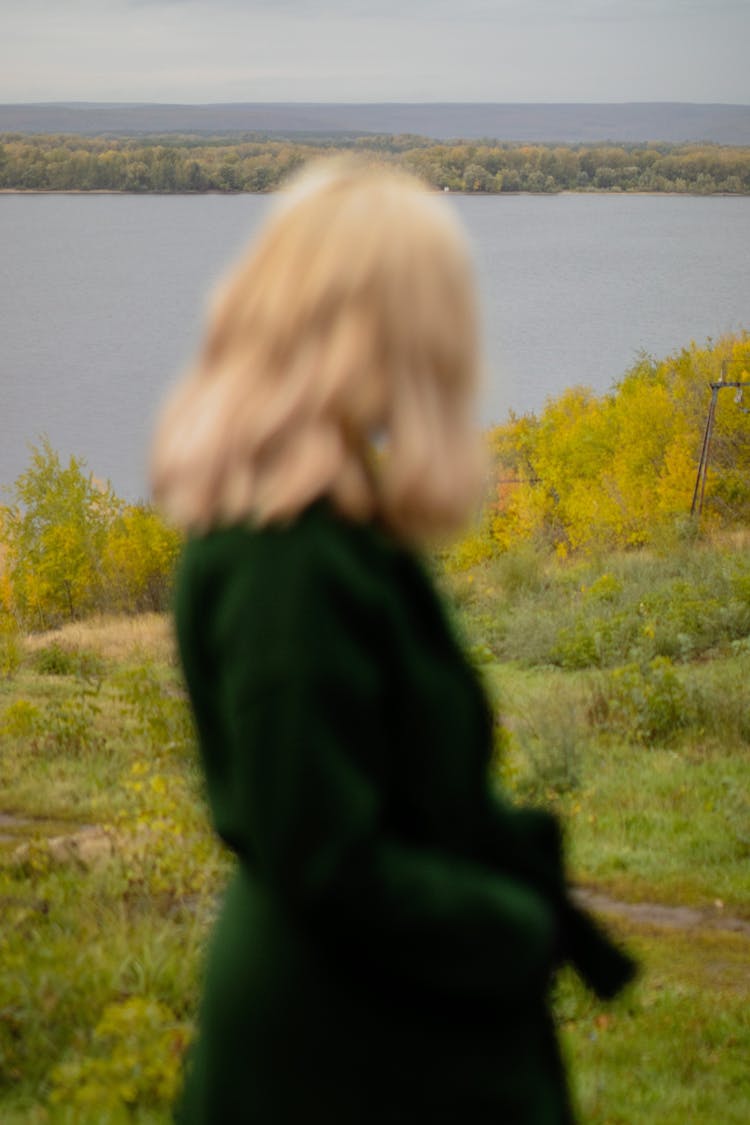 Blonde Woman In A Coat Looking Around