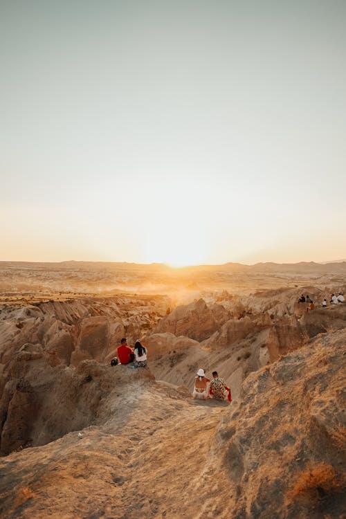 Tourists Watching Sunrise in the Mountains 