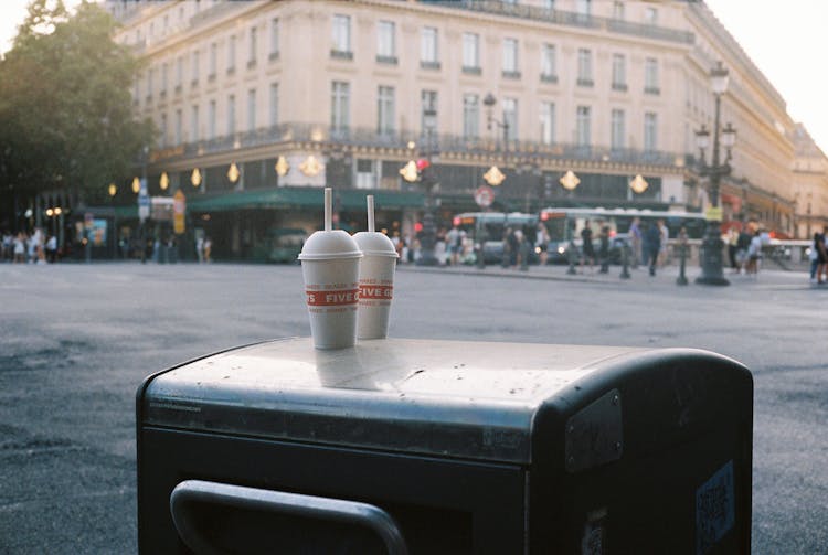 Shakes On Top Of Trash Can On City Street