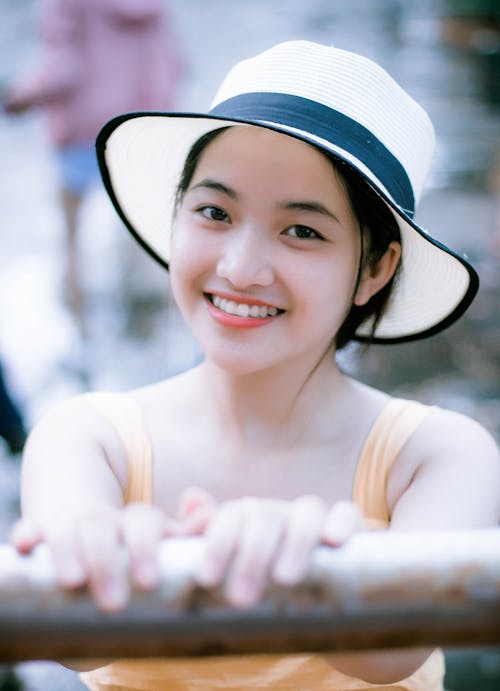 Portrait Photography of Woman Wearing White and Black Hat