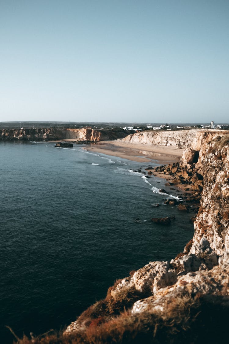 Rock Coast Near Calm Sea Water