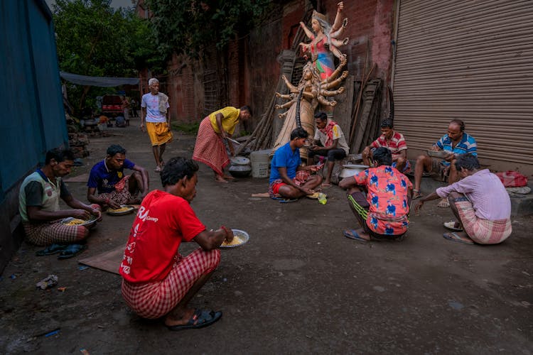 People Eating On A Street