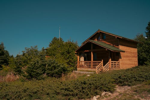 Wooden House with a Porch in a Rural Area 